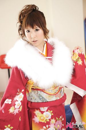 Asian Yuko Morita looks fantastic in a kimono and with a fur collar.