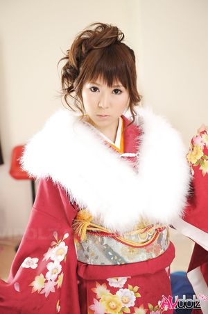 Asian Yuko Morita looks fantastic in a kimono and with a fur collar.