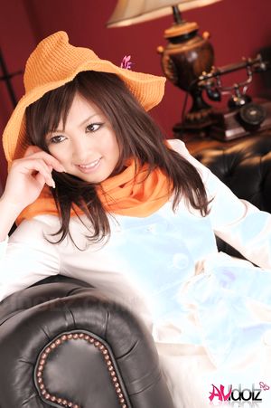 Sayuri Ito in white coat and high heels shows sexy legs when posing.