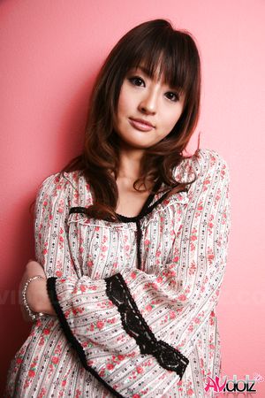 Hot Saori licks her lips erotically when posing in a beautiful outfit.