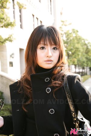 Gorgeous Saori is so elegant in a coat while walking through the city.