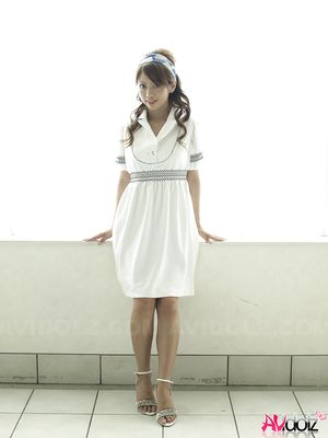 Misato Matsu looks so beautiful and stylish in a white dress for pics.