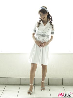Misato Matsu looks so beautiful and stylish in a white dress for pics.