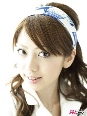 Misato Matsu looks so beautiful and stylish in a white dress for pics.