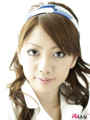 Misato Matsu looks so beautiful and stylish in a white dress for pics.