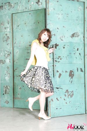 Mika Ito spreads legs and shows shaved cunt at a photo shooting.