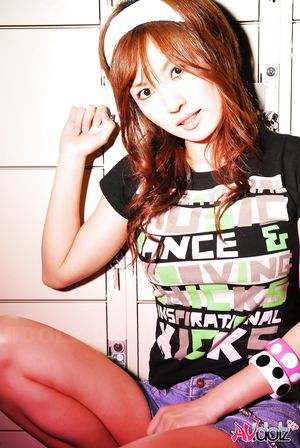 Asian Mecumi smiles all the time posing in short skirt and T-shirt.