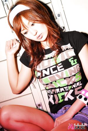 Asian Mecumi smiles all the time posing in short skirt and T-shirt.