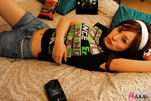 Superb Mecumi takes her clothes off while playing so nasty in bed.