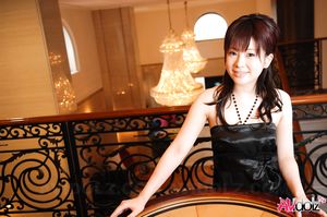 Beautiful Hina Kawamura in black dress enjoys a glass of champagne.