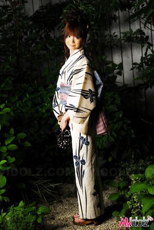 Anna Watanabe in kimono is cute playing with a firework outdoor.