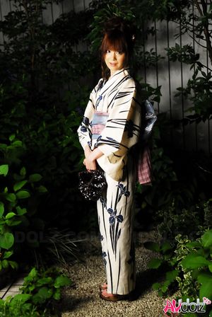 Anna Watanabe in kimono is cute playing with a firework outdoor.