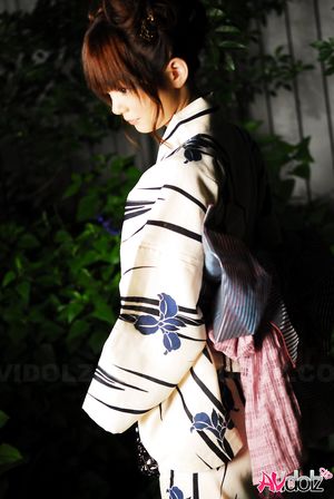 Anna Watanabe in kimono is cute playing with a firework outdoor.