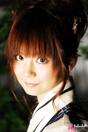 Anna Watanabe in kimono is cute playing with a firework outdoor.