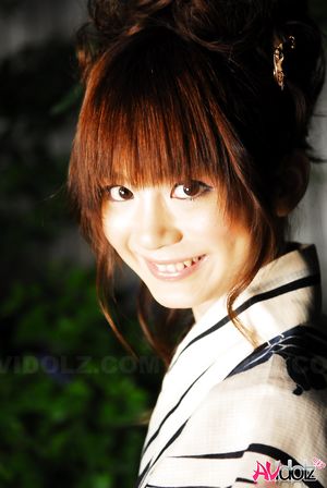 Anna Watanabe in kimono is cute playing with a firework outdoor.