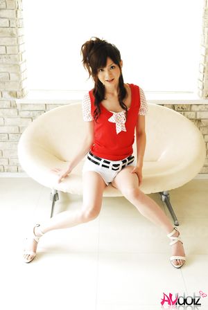 Anna Watanabe exposes her hot body in short pants and red blouse.
