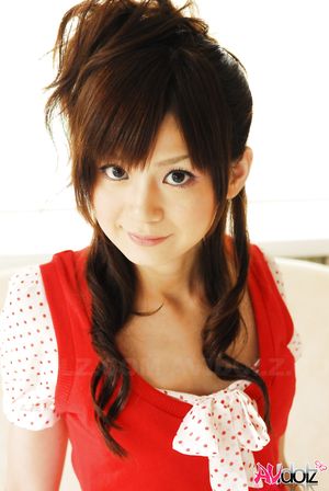 Anna Watanabe exposes her hot body in short pants and red blouse.