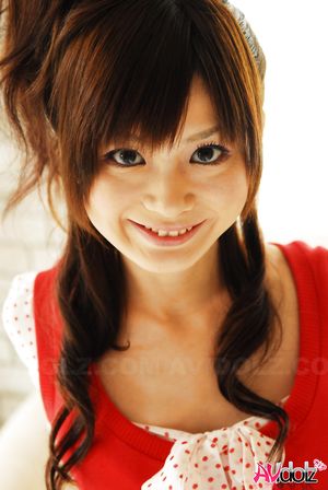 Anna Watanabe exposes her hot body in short pants and red blouse.