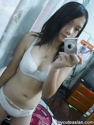 Asian teen shows off small tits n shaved pussy in really hot selfshot naked pics