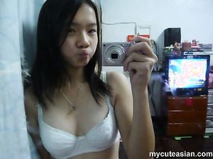 Asian teen shows off small tits n shaved pussy in really hot selfshot naked pics