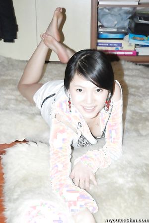 Cute Asian girlfriend is posing in sexy lingerie for the camera