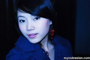 Cute Asian girlfriend is posing in sexy lingerie for the camera