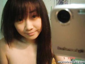 Selfmade sexy photos of cute Asian teen posing nude at home