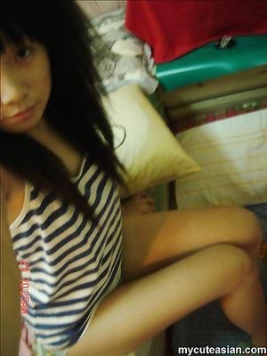 Selfmade sexy photos of cute Asian teen posing nude at home
