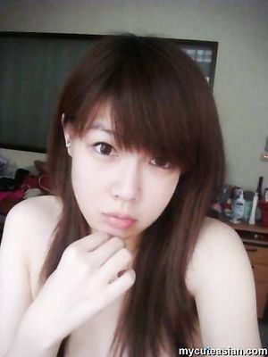 Selfmade photos of Busty and Gorgeous Asian girlfriend at home