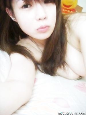 Selfmade photos of Busty and Gorgeous Asian girlfriend at home