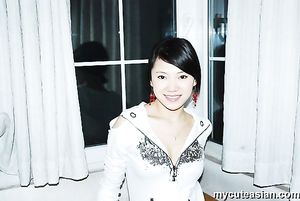 Homemade photos of cute Asian girlfriend posing for the camera