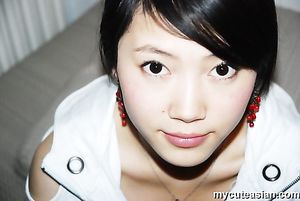 Homemade photos of cute Asian girlfriend posing for the camera