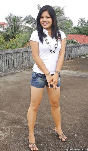 Lovely Asian amateur teen teasing us in front of her house