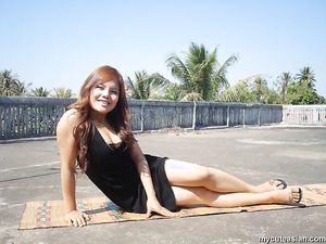 Busty and sexy Filipino amateur girlfriend is posing outdoor