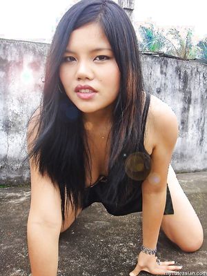 Busty and sexy Filipino amateur girlfriend is posing outdoor