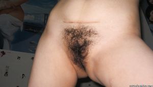 Naked Asian amateur wife opens her legs wide to show her hairy pussy