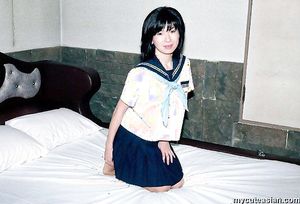 Lovely japanese coed in uniform spreads her tight trimmed pussy here