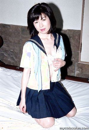 Lovely japanese coed in uniform spreads her tight trimmed pussy here