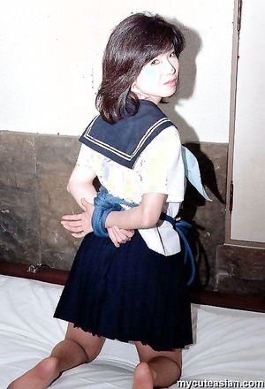 Lovely japanese coed in uniform spreads her tight trimmed pussy here