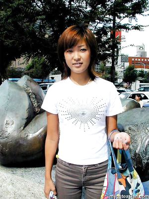 Horny asian amateur teen is stripping on the sofa and posing nude