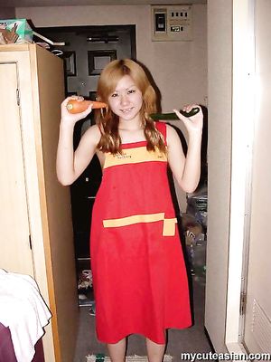 Naughty asian amateur teen puts carrot and cucumber in her tight pussy
