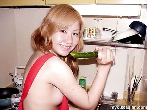 Naughty asian amateur teen puts carrot and cucumber in her tight pussy