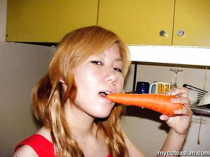 Naughty asian amateur teen puts carrot and cucumber in her tight pussy
