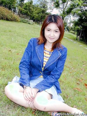 Lovely asian girl shows her sexy underwears and pussy in public park