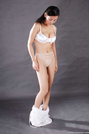 Sexy chinese woman in whites panties and makes a hot strip tease