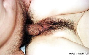 Busty chinese girl pushes a red dildo into her tight asian pussy