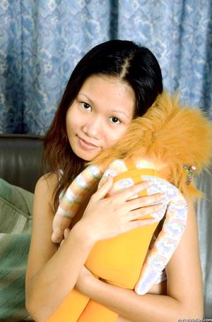 Asian teenie with a small breasts spreads her tight wet pussy