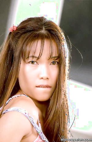 Horny asian with large nipples spreads her pussy in kitchen