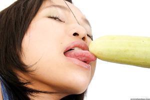 Naughty thai slut with big breasts puts fruits in her hairy pussy