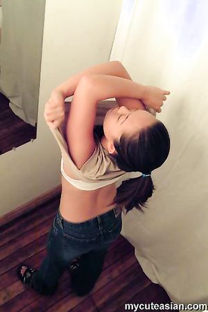 Sexy asian babe catch with a hidden cam in a changing room